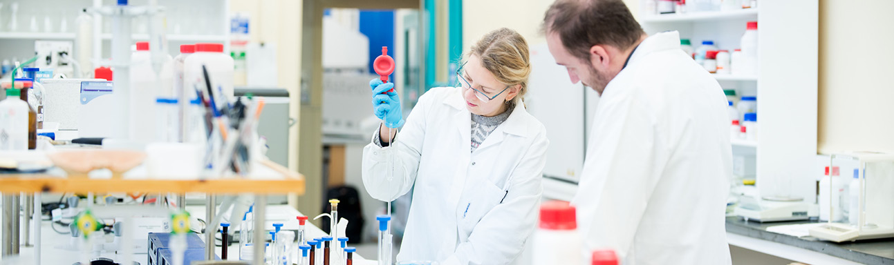 image of 2 students carrying out work in the laboratory at the Environmental Research Institute