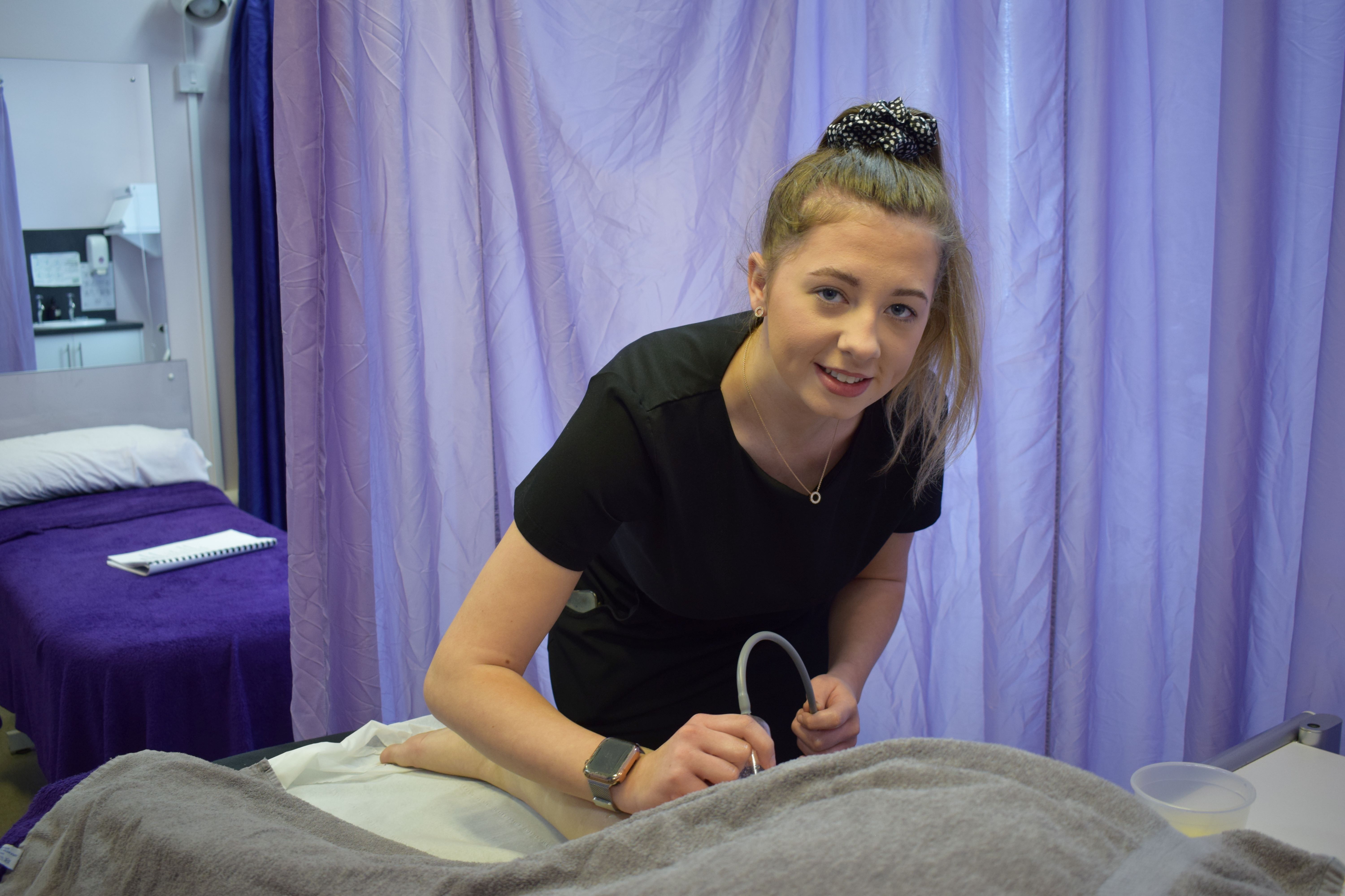 Teigan Campbell, beauty student carrying out a treatment in the commercial salon