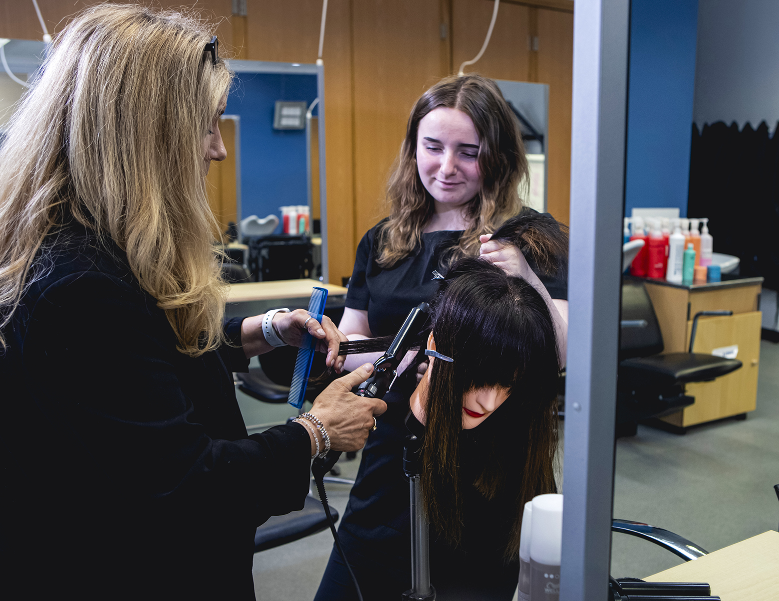 hairdressing student learning how to style hair