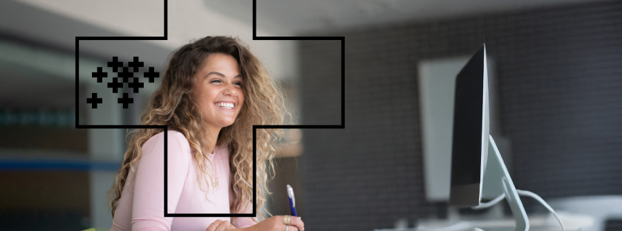 Student at computer working smiling Student at computer working smiling