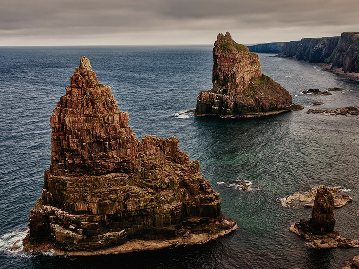 shot of the sea with 2 stacks