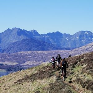 people on a hill walk