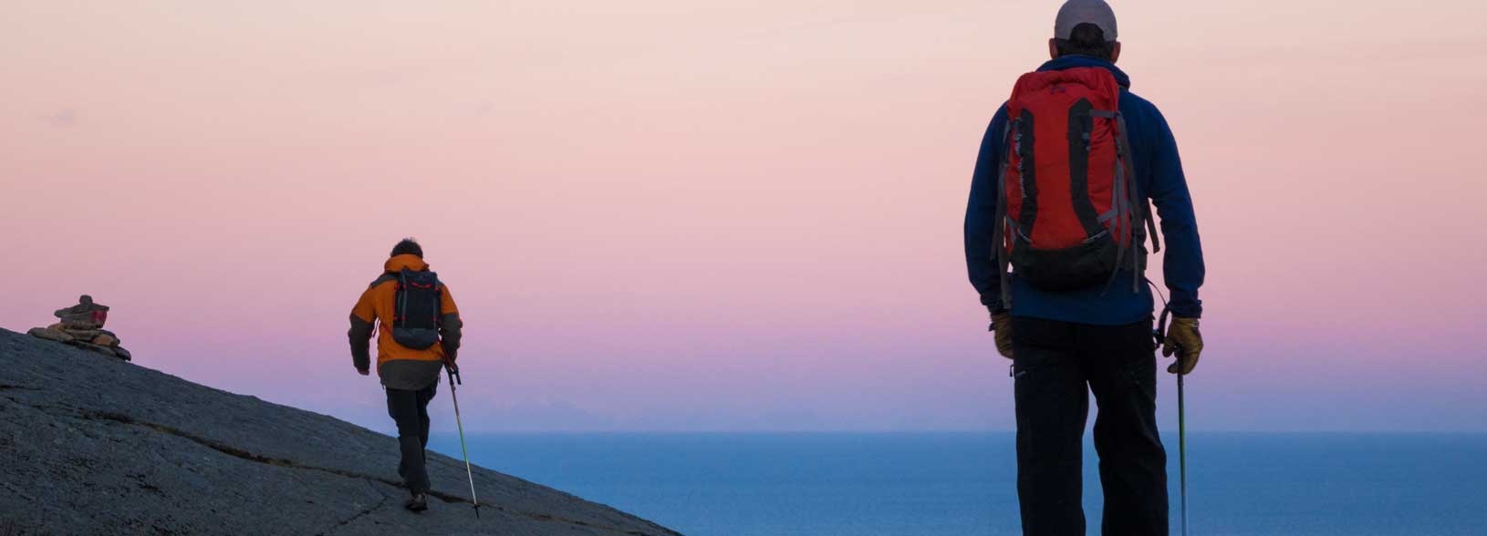 people outdoors at sunset