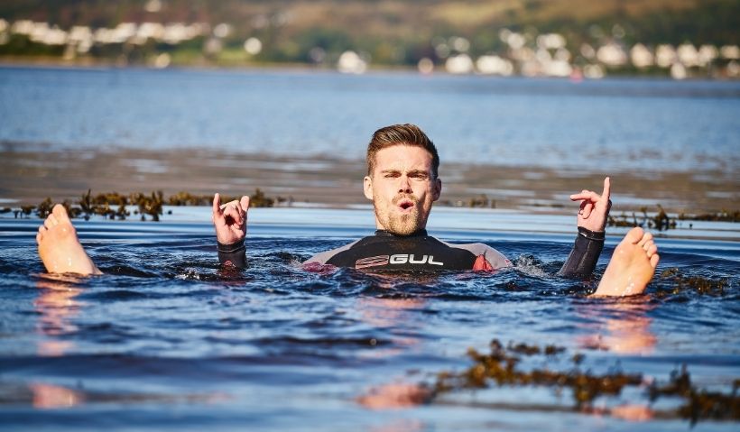 Student relaxing in the sea