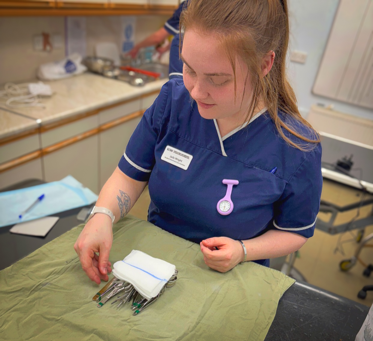 Jade Wright Veterinary Care Assistant student preparing equipment in the Veterinary practice