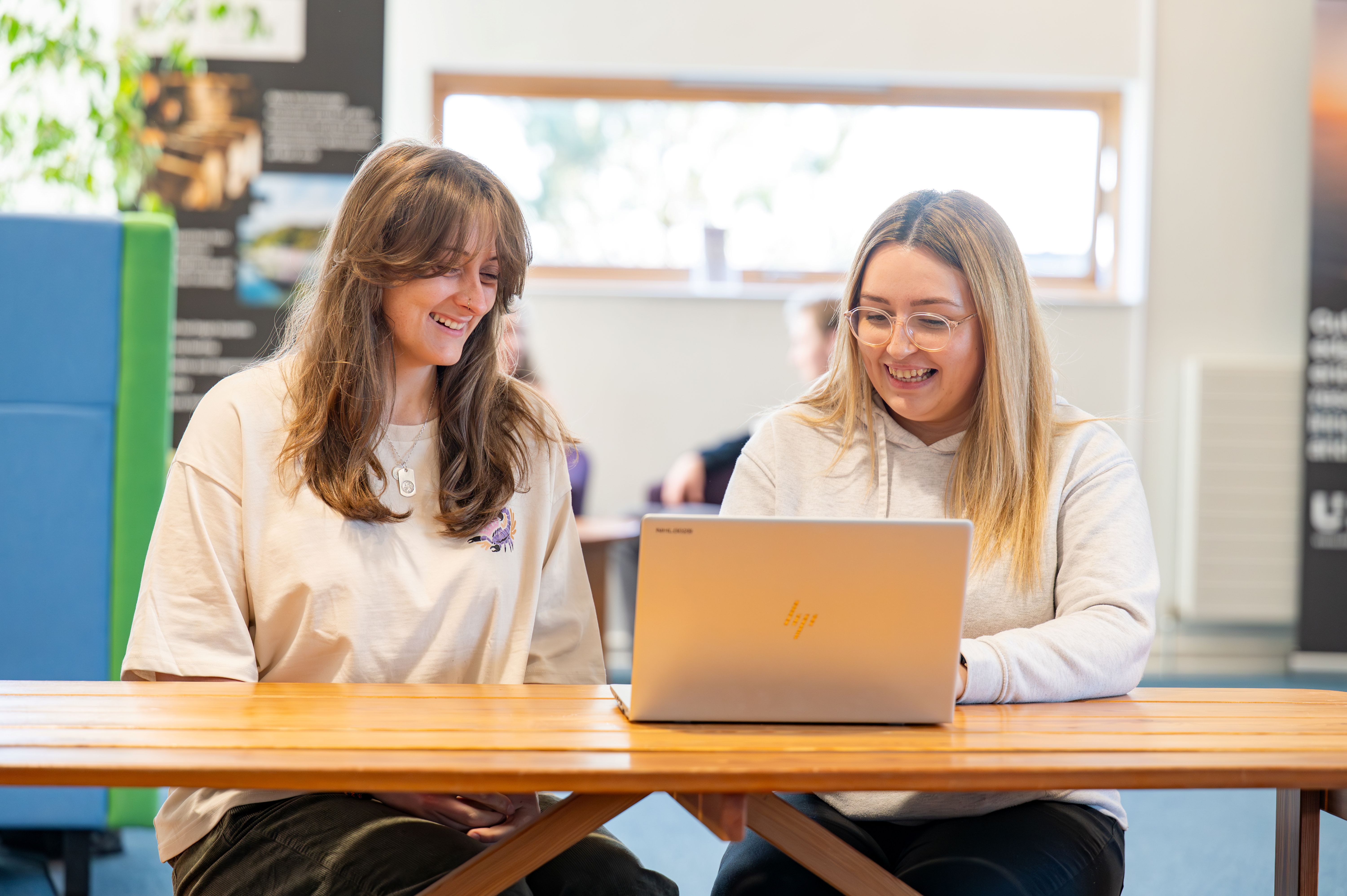 Business students at computer Business students at computer