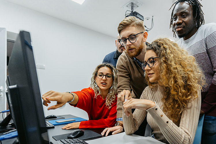 students working on computer