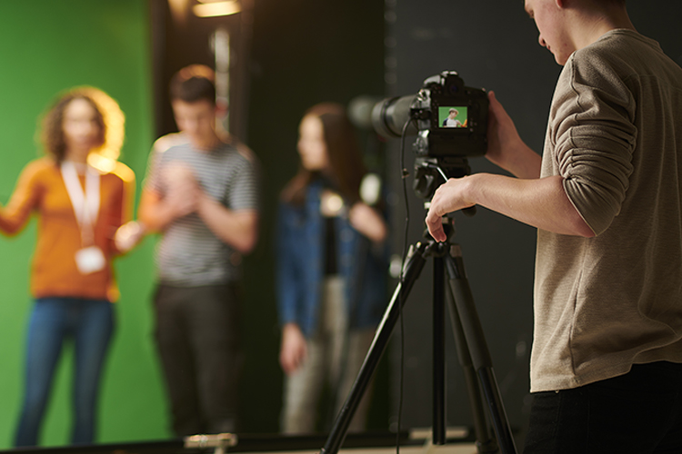 media students working with camera