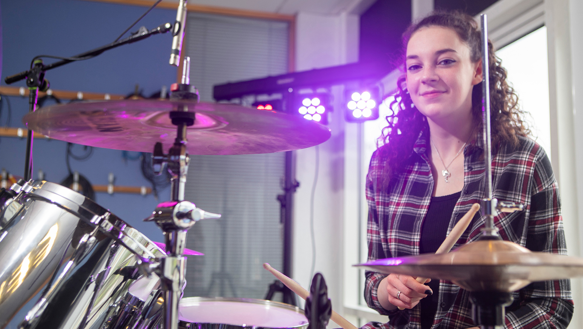 student playing drums