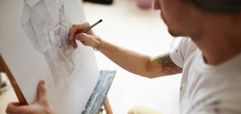 Student doing a pencil drawing