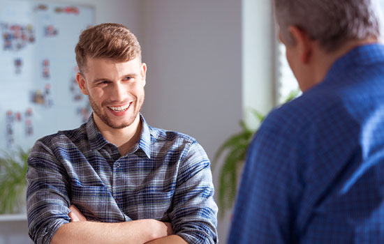 Student chatting with a member of staff